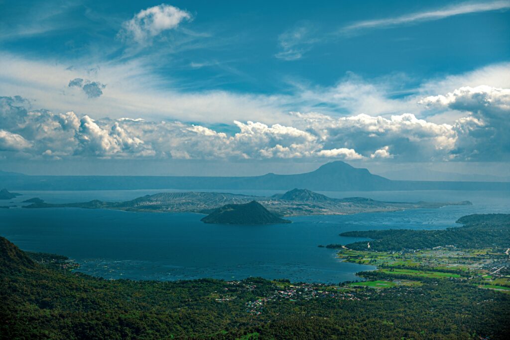 Taal Volcano and Lake Viewpoint — Rooftop Camper Destination in the Philippines A breathtaking view of Taal Lake and Volcano from a camper-friendly location in the Philippines